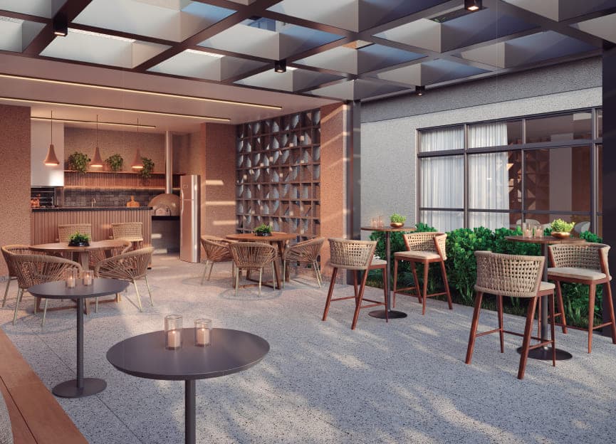 Espaço gourmet coberto com forno de pizza, bancada, mesas e banquetas altas